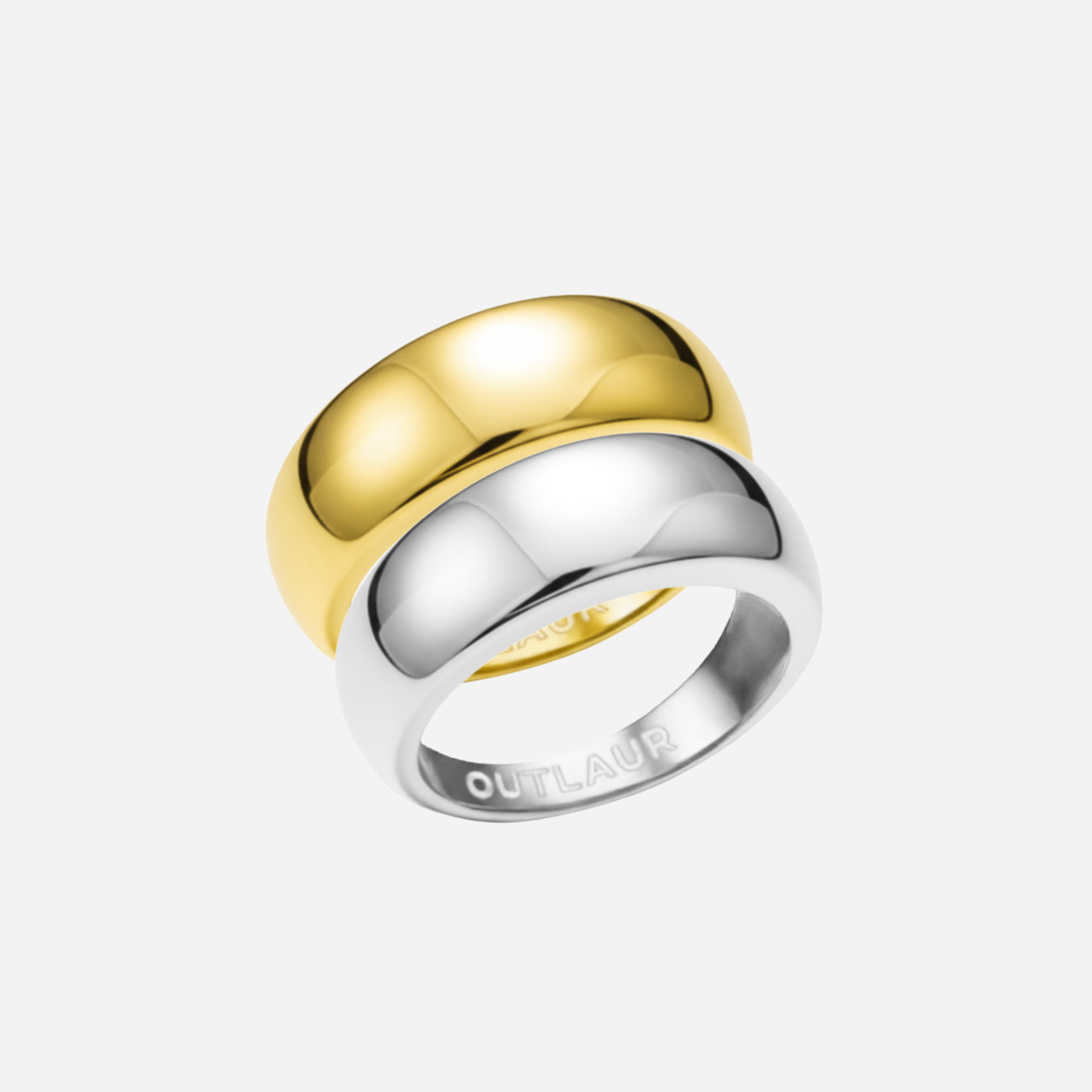 Two-tone gold and silver ring on a white background